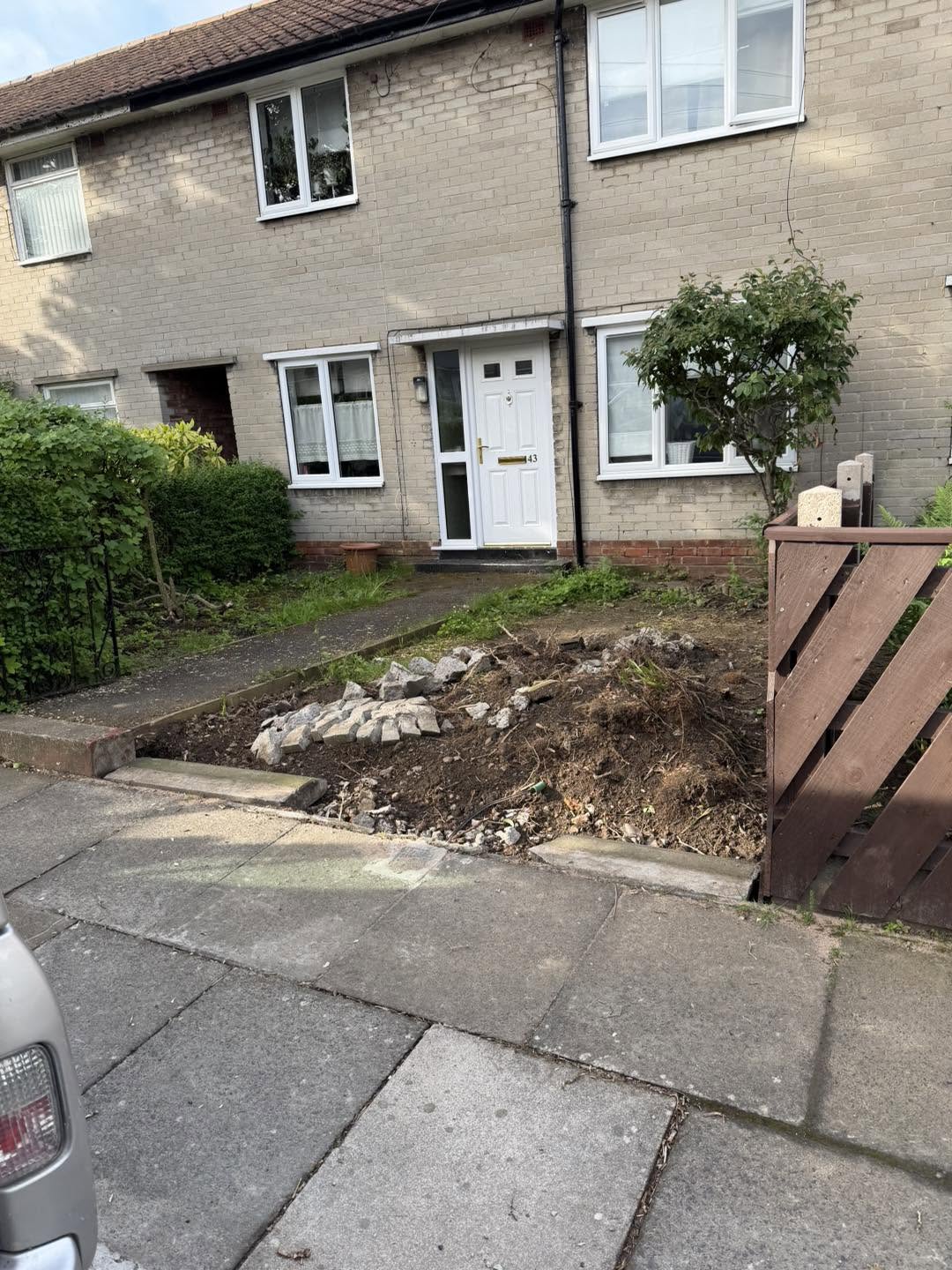 Damaged garden section before construction work